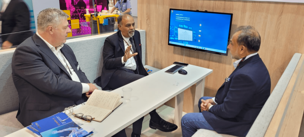 Rajesh Saxena and Dave Revel in conversation with a Customer